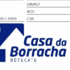 Logotipo da Casa da Borracha, loja de Botucatu, com formato triangular e texto azul.