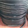 Bobinas de mangueiras pretas da marca Continental, especificações visíveis na lateral.