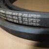 Correias Goodyear CC255 HEX sobre fundo marrom.