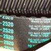Correia preta com letras verdes G-2520 e instruções 'DO NOT CRIMP'.